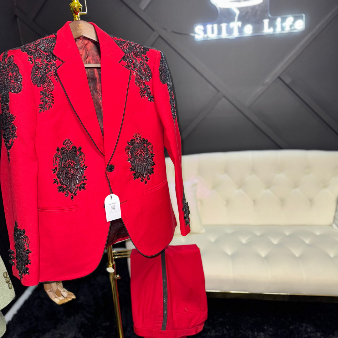 Red suit with black cross and black embellishments