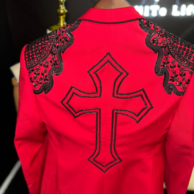 Red suit with black cross and black embellishments
