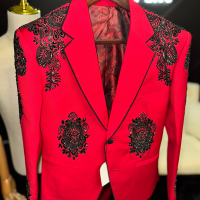 Red suit with black cross and black embellishments