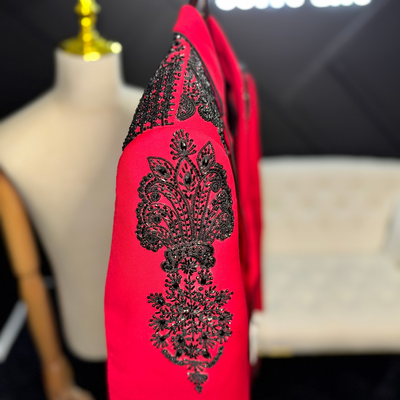 Red suit with black cross and black embellishments