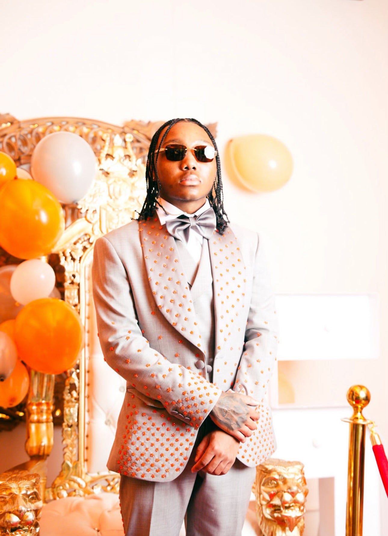 Grey suit with orange embellishments
