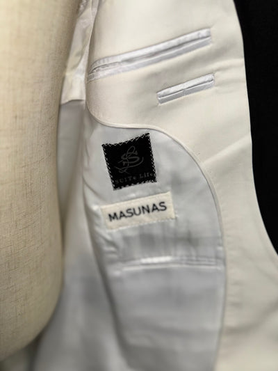 White suit with black lapel