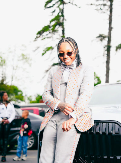 Grey suit with orange embellishments