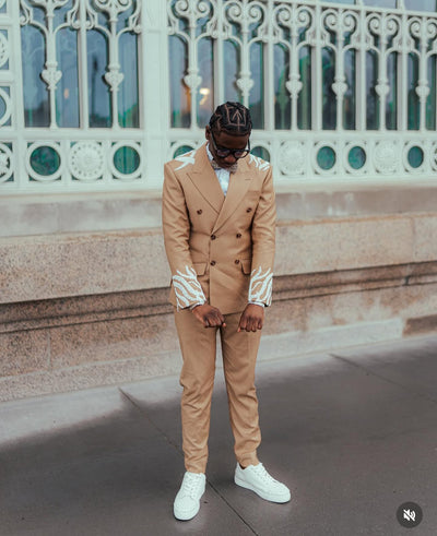 Tan suit with white embellishments