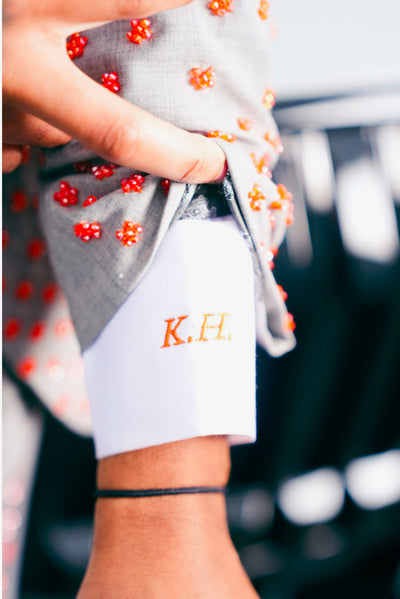 Grey suit with orange embellishments