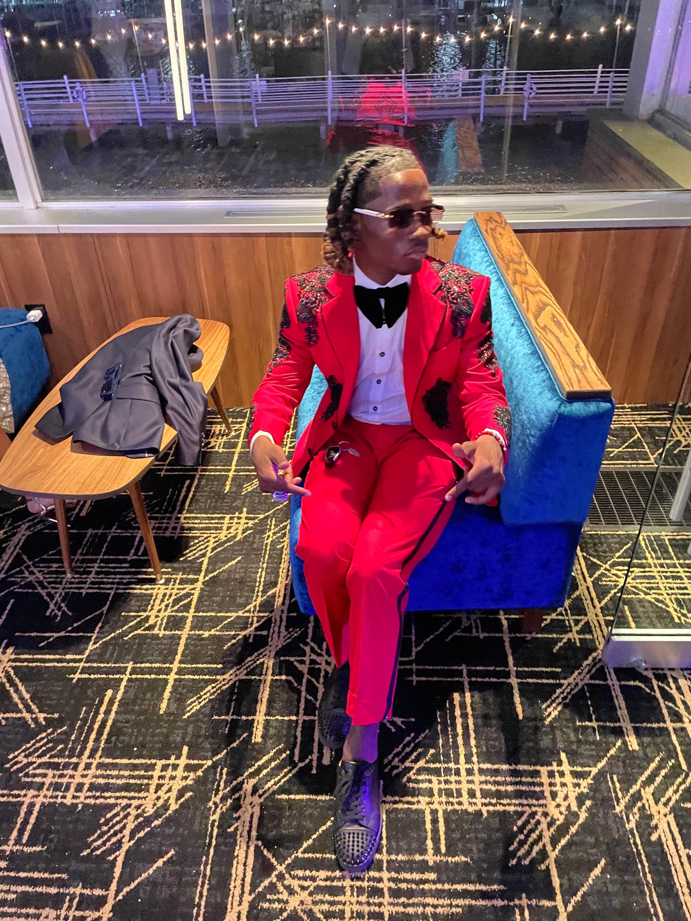Red suit with black cross and black embellishments