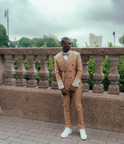 Tan suit with white embellishments