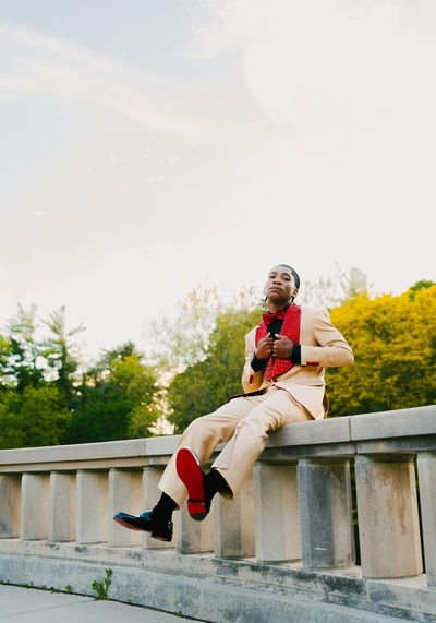 Tan suit with red crystalized lapel