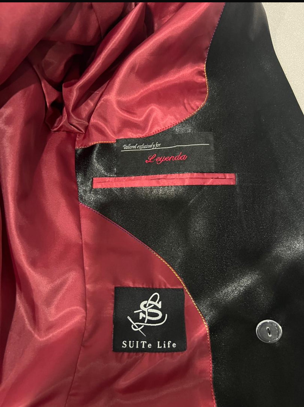 Black and red print suit with rope