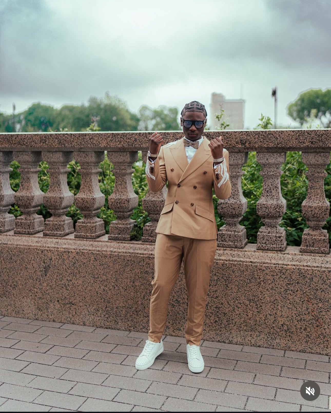 Tan suit with white embellishments