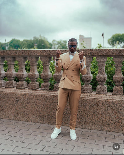 Tan suit with white embellishments